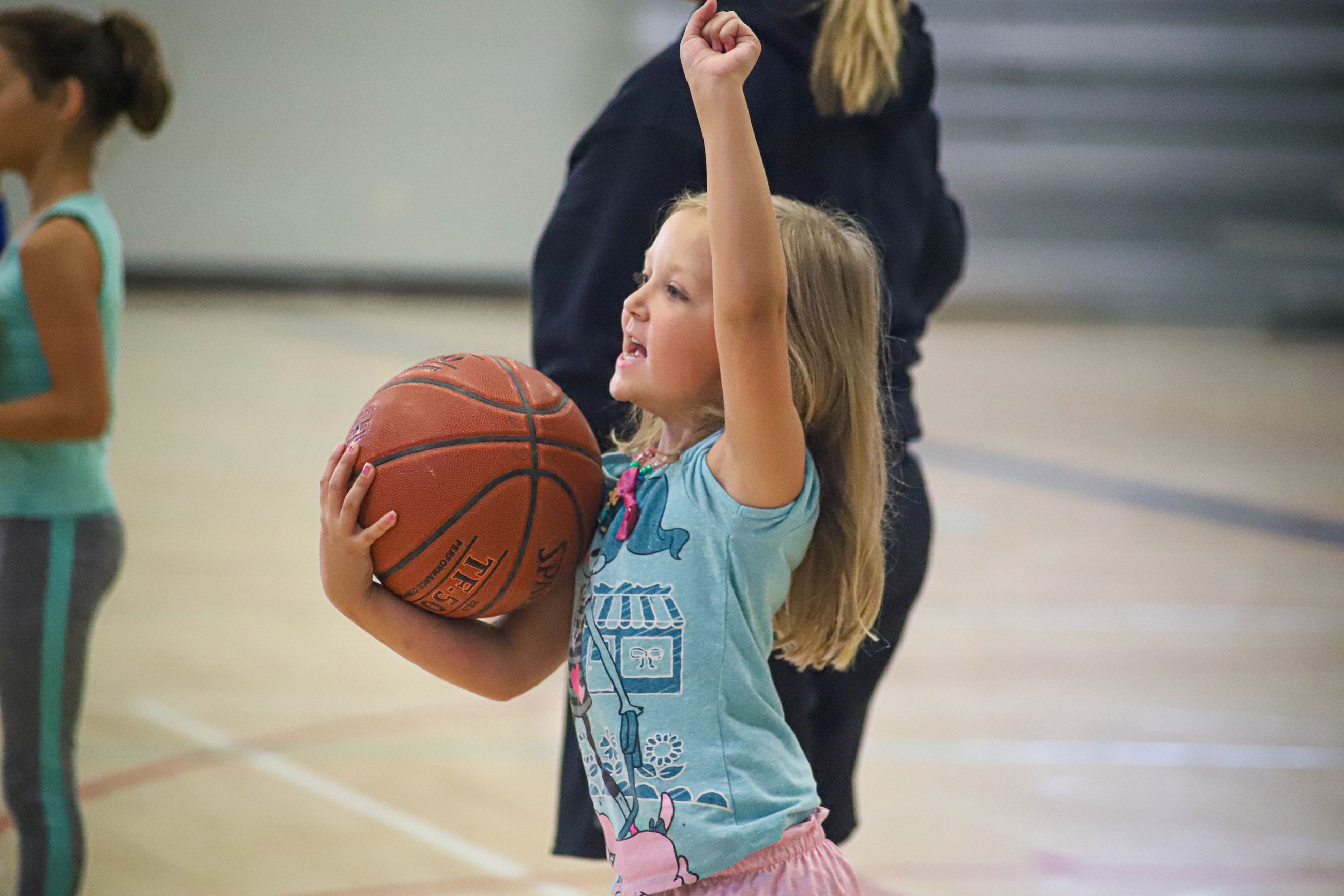 Girl holding basketball